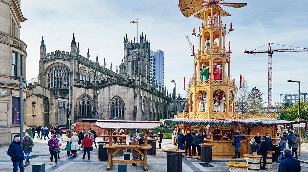 Christmas market by cathedral, Manchester, UK